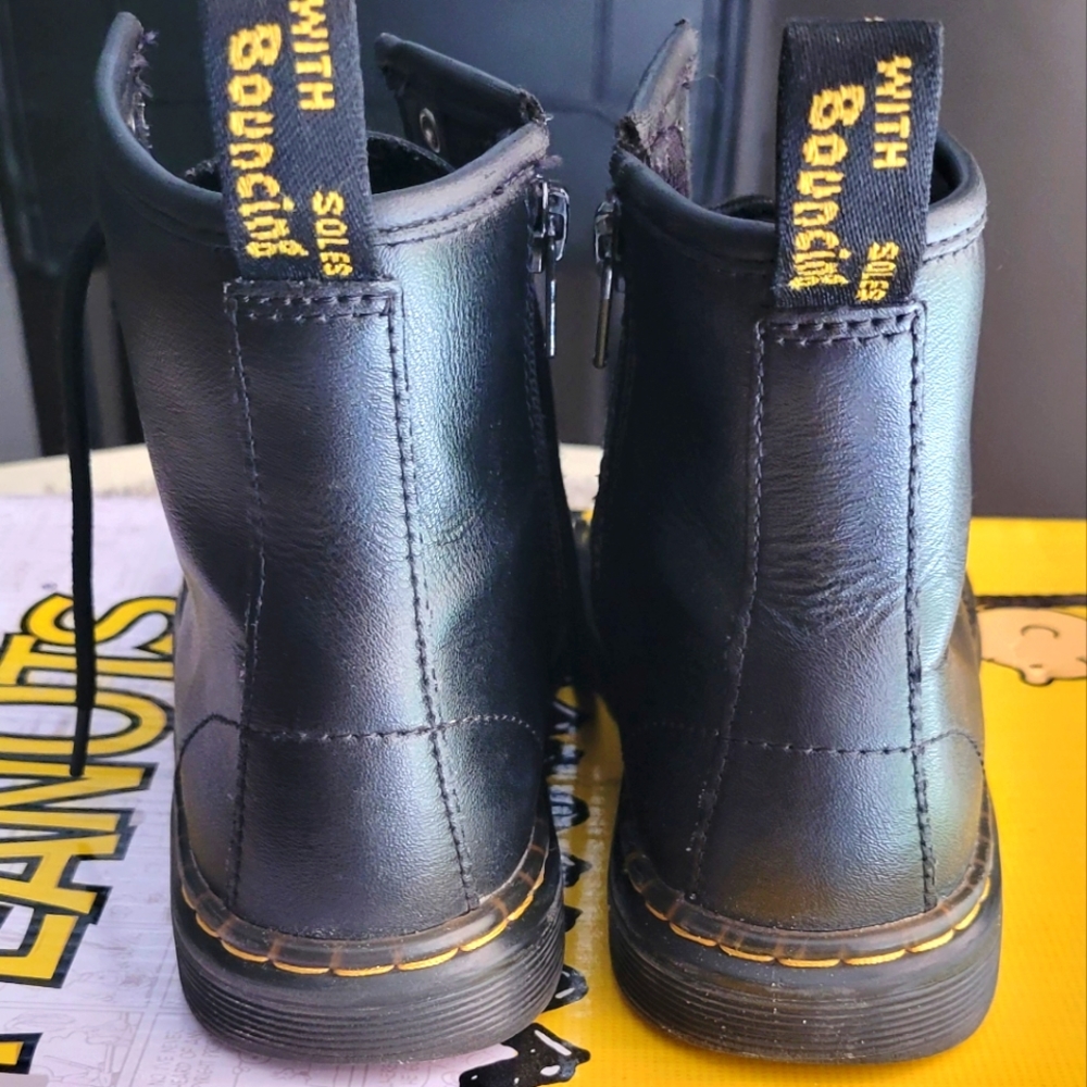 Children's size 2 Doc Martens fashion black boots with inside zipper.